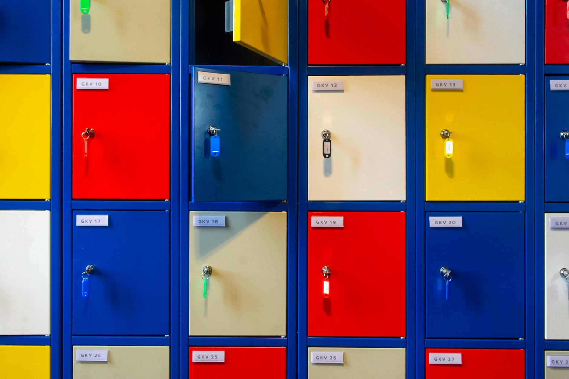 Multicolored storage lockers with keys, showcasing vibrant organization.