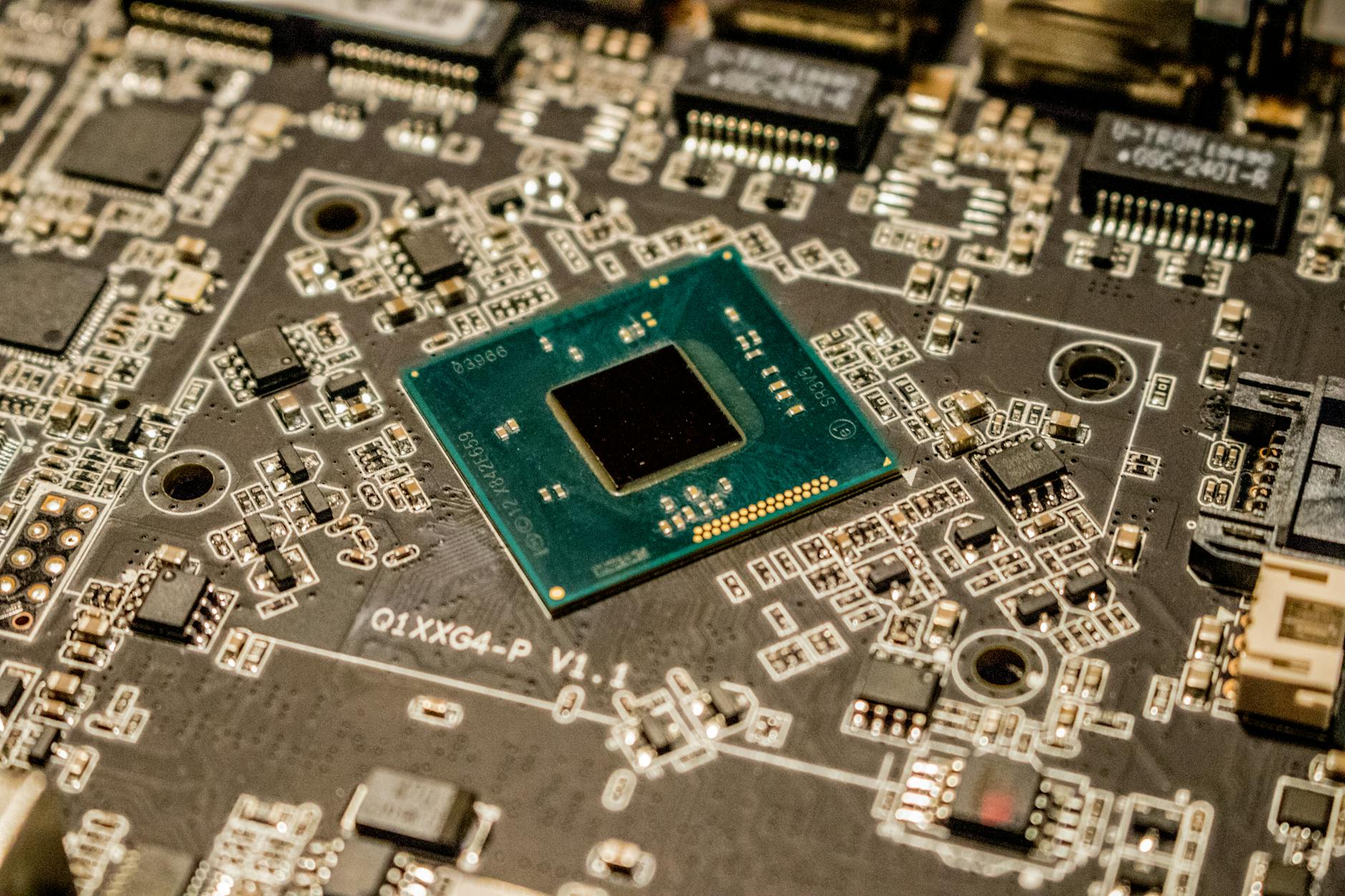 Detailed view of a microchip on a printed circuit board, showcasing electronic components.